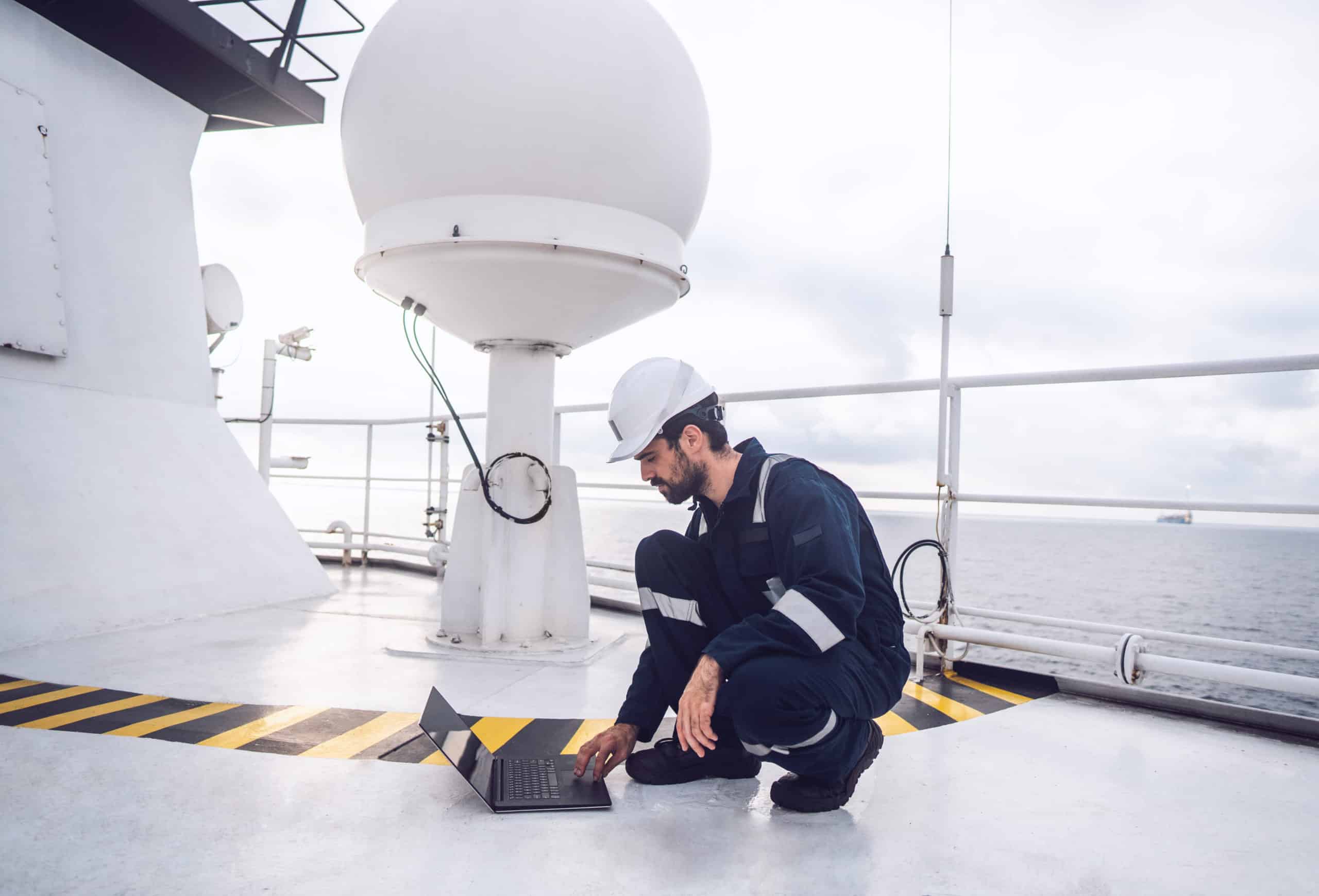 Technical service or service engineer operating on vessel satellite communication